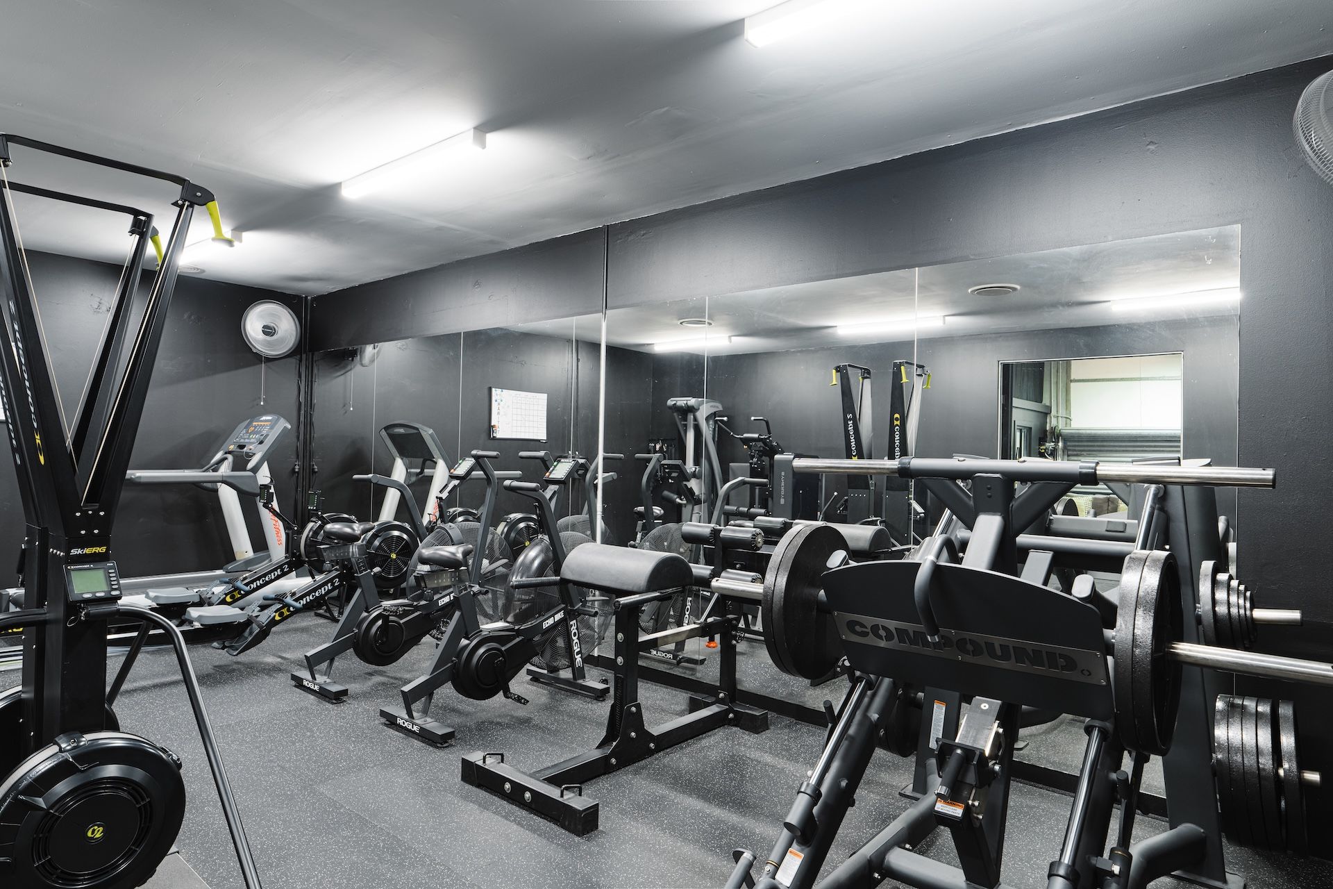 Full view of upstairs Machine Hub at Habitat Gym with cardio and resistance machines
