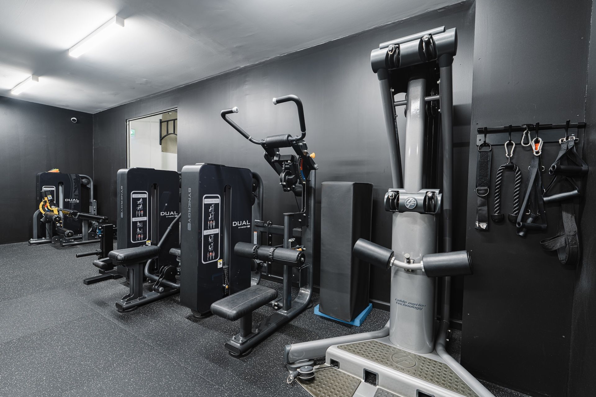 Alternate angle of Habitat Gym’s Machine Hub with strength and cardio equipment