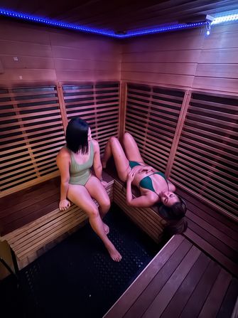 Habitat members inside sauna relaxing