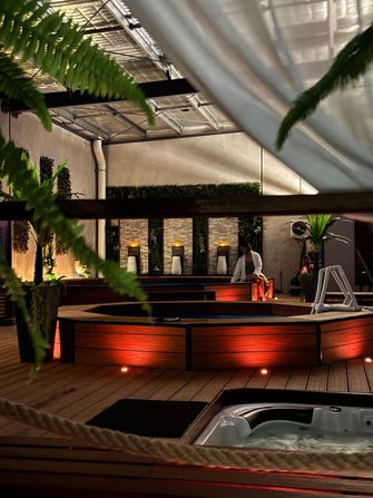 Customer relaxing inside spa at a bathhouse