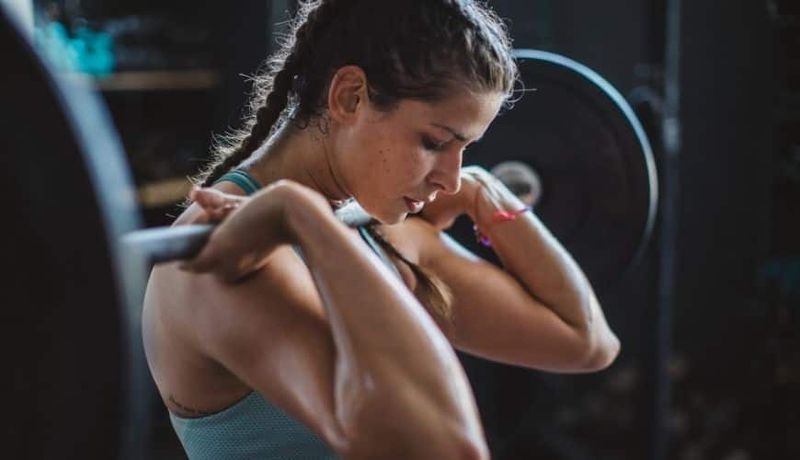 Woman lifting weights at the gym